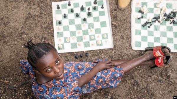 Arusi Wegeneza, 13, poses for a photo during a chess game at the Soga Chess Club of the internally displaced persons camp in Kanyaruchinya, Democratic Republic of Congo, on July 29, 2024.